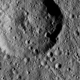 This ancient crater on Ceres displays a flattened floor and a low, rounded central peak. NASA's Dawn spacecraft captured the scene on Jan. 2, 2016.