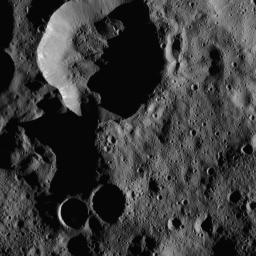 Heavily-shadowed craters in the northernmost latitudes of Ceres are seen in this view from NASA's Dawn spacecraft, taken on Jan. 25, 2016.