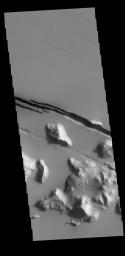 This image captured by NASA's 2001 Mars Odyssey spacecraft shows part of Cerberus Fossae. The linear depressions are called fossae.