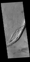 This image captured by NASA's 2001 Mars Odyssey spacecraft shows both linear and sinuous channel forms.