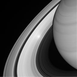 An ethereal, glowing spot appears on Saturn's B ring in this view from NASA's Cassini spacecraft. The glowing effect is an example of an 'opposition surge' making that area on the rings appear extra bright.