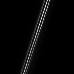 When seen up close, the F ring of Saturn resolves into multiple dusty strands. NASA's Cassini spacecraft's view shows three bright strands and a very faint fourth strand off to the right.
