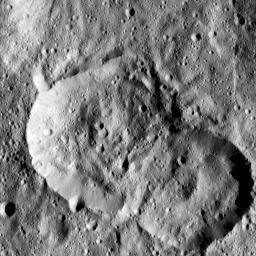 NASA's Dawn spacecraft spotted this pair of craters on Ceres on January 25, 2016. The crater at left is named Jaja, after the Abkhazian harvest goddess. Jaja Crater is 13 miles (21 kilometers) in diameter and is located in the northern hemisphere.