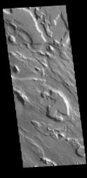 This image from NASA's 2001 Mars Odyssey spacecraft shows part of the complex channel floor of Ares Vallis.