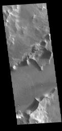 The channel feature in this image from NASA's 2001 Mars Odyssey spacecraft is called Mangala Fossa. This feature was formed by tectonic activity, with the walls being faults that allowed the central portion to slide downward forming a graben.