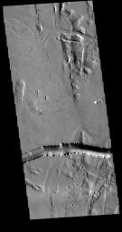 This image captured by NASA's 2001 Mars Odyssey spacecraft shows part of Olympica Fossae.