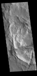This image captured by NASA's 2001 Mars Odyssey spacecraft shows a portion of the margin between the higher elevations of Xanthe Terra and the lower elevations of Hydraotes Chaos.