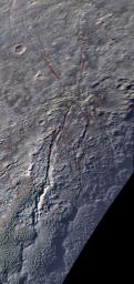 An unusual geological feature resembling a giant spider sprawls across Pluto's icy landscape in this enhanced color image was obtained by NASA's New Horizons spacecraft on July 14, 2015.