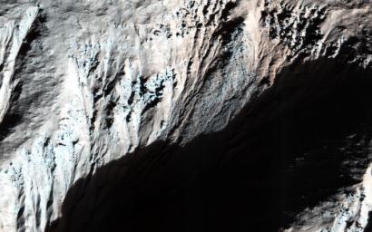 This image from NASA's Mars Reconnaissance Orbiter spacecraft was acquired to look for frost on these generally equator-facing slopes on Mars, which are visible in the shadows after enhancing the brightness levels.