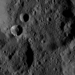 Patches of bright material can be seen on the walls of a relatively fresh crater on Ceres in this view from NASA's Dawn spacecraft.