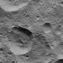 This picture from NASA's Dawn spacecraft shows craters in the northern hemisphere of Ceres. The large crater at lower left displays several bright streaks on its walls.
