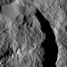 Datan Crater is featured in this scene from Ceres captured by NASA's Dawn spacecraft. Datan is imprinted on the older Geshtin Crater, whose terrain fills the rest of the view.