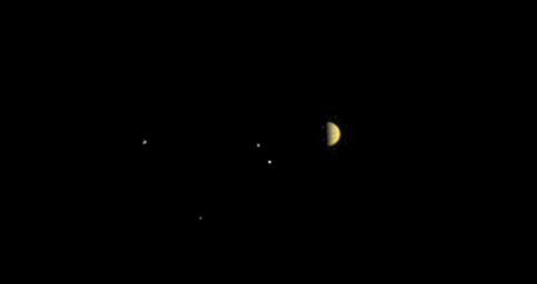 NASA's Juno spacecraft obtained this color view on June 21, 2016. As Juno makes its initial approach, the giant planet's four largest moons, Io, Europa, Ganymede and Callisto, are visible.