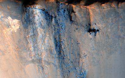 This image captured by NASA's Mars Reconnaissance Orbiter spacecraft targets a 3-kilometer diameter crater that occurs within the ejecta blanket of the much older Bakhuysen Crater, a 150-kilometer diameter impact crater in Noachis Terra.