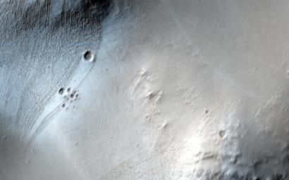 This observation from NASA's Mars Reconnaissance Orbiter spacecraft is of Noctis Labyrinthus, a highly tectonized region immediately to the west of Valles Marineris. It formed when Mars' crust stretched itself apart.