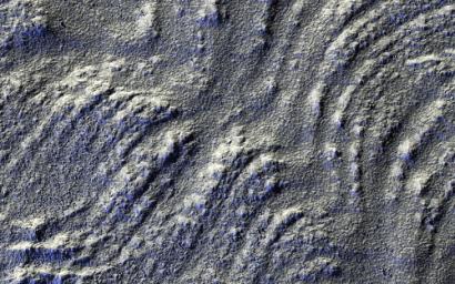 This image captured by NASA's Mars Reconnaissance Orbiter spacecraft has low-sun lighting that accentuates the many transverse ridges on this slope, extending from Euripus Mons (mountains).