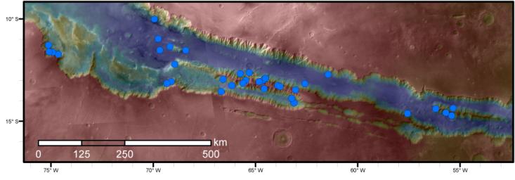 Blue dots on this map indicate sites of recurring slope lineae (RSL) in part of the Valles Marineris canyon network on Mars, from NASA's Mars Reconnaissance Orbiter.