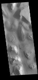 This image captured by NASA's 2001 Mars Odyssey spacecraft shows a small portion of Hydraotes Chaos. Chaos is defined as a distinctive area of broken terrain.
