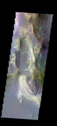 The THEMIS camera contains 5 filters. The data from different filters can be combined in multiple ways to create a false color image. This image from NASA's 2001 Mars Odyssey spacecraft shows the northern part of Terby Crater.