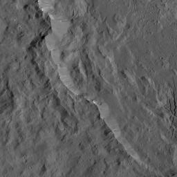 A portion of the rugged rim of Occator Crater is seen in this image from NASA's Dawn spacecraft. Occator, a young crater approximately 80 million years old.