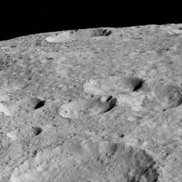 NASA's Dawn spacecraft looked northward toward the limb of Ceres to capture this scene, with Rao Crater (7 miles, 12 kilometers) at bottom.