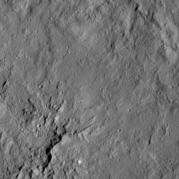 This view from NASA's Dawn spacecraft shows peaks in the center of Dantu Crater (78 miles, 125 kilometers) on Ceres. Dantu is named for a Ghanan god associated with the planting of corn.