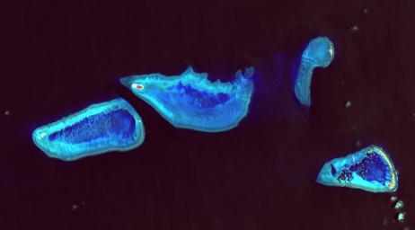 Heron Island is located in Queensland, Australia, off the Australian mainland. The island is famous for diving and snorkeling and is a World Heritage-Listed Marine National Park. NASA's Terra spacecraft acquired this image on December 22, 2001.