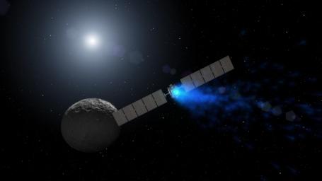 This artist's rendering shows NASA's Dawn spacecraft maneuvering above Ceres with its ion propulsion system. Dawn arrived into orbit at Ceres on March 6, 2015, and continues to collect data about the mysterious and fascinating world.