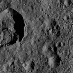This view of Ceres from NASA's Dawn spacecraft, taken on May 29, 2016, features a small crater at upper left that adjoins Messor Crater.