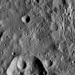 This image from NASA's Dawn spacecraft, taken June 7, 2016, shows part of Lono Crater (at bottom) within the giant Yalode impact basin on Ceres.