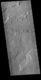 This image captured by NASA's 2001 Mars Odyssey spacecraft shows a very small portion of the extensive lava flows of the Tharsis volcanic complex.