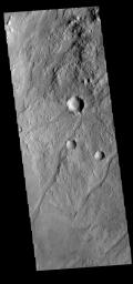 The linear depressions in this image from NASA's 2001 Mars Odyssey spacecraft are some of the numerous graben that make up Claritas Fossae.