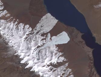 This image from NASA's Terra satellite taken on Sept. 22, 2016, shows a deadly avalanche tumbling down a Tibetan mountain.