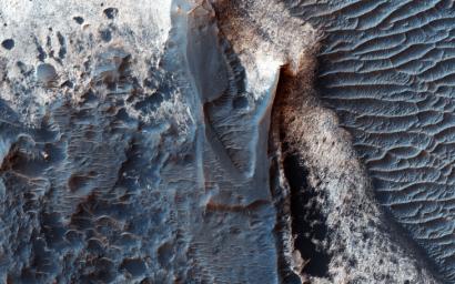 This image from NASA's Mars Reconnaissance Orbiter shows mounds of light-toned deposits within the central portion of Valles Marineris.