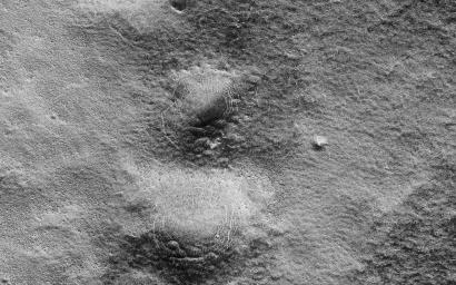 This image captured by NASA's Mars Reconnaissance Orbiter shows a lava channel north of Kuiper Crater in the high southern latitudes just before spring equinox.