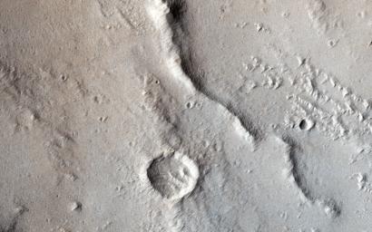 In this image from NASA's Mars Reconnaissance Orbiter tectonic stresses highly modified this area of Ganges Catena, north of Valles Marineris.
