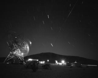 This archival photograph shows the first pass of Echo 1, America's first communications satellite, over the Goldstone Tracking Station managed by NASA's Jet Propulsion Laboratory, in Pasadena, California, in the early morning of Aug. 12, 1960.