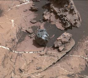 The dark, smooth-surfaced object at the center of this Oct. 30, 2016, image from the Mast Camera (Mastcam) on NASA's Curiosity Mars rover was examined with laser pulses and confirmed to be an iron-nickel meteorite.