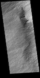 The margin of Olympus Mons consists of a cliff-like edge where elevation changes very quickly over a very small width. This image captured by NASA's 2001 Mars Odyssey spacecraft shows part of that edge.