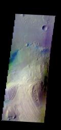 The THEMIS camera contains 5 filters. The data from different filters can be combined in multiple ways to create a false color image. This image from NASA's 2001 Mars Odyssey spacecraft shows part of the interior mound of material within Gale Crater.