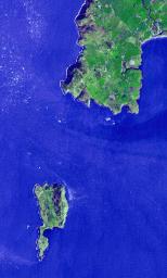 Lying 3 km off the Llyn peninsula of Wales, this image from NASA's Terra spacecraft shows Bardsey Island, known as the Island of 20,000 saints. While today's permanent population numbers only four, the island was once an important religious site.