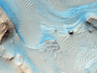 NASA's Mars Reconnaissance Orbiter captured this image of Nili Fossae, layered bedrock as horizontal striations in the light toned sediments in the floor of a canyon near Syrtis Major.