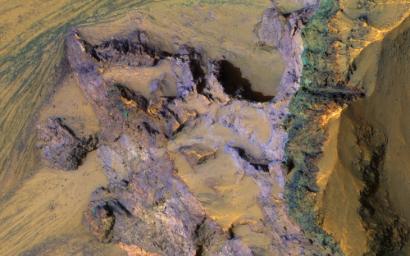 The steep walls of Valles Marineris sometimes fail, creating giant landslides. This provides a clean exposure of the underlying bedrock, as seen image from NASA's Mars Reconnaissance Orbiter.