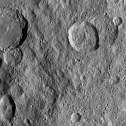 This image, taken by NASA's Dawn spacecraft, shows Azacca Crater (31 miles, 50 kilometers wide) at top left, with its prominent set of north-south trending fractures. Dawn took this image on Oct. 17, 2016.