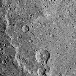 Kerwan Crater, at 174 miles (280 kilometers) in diameter is the largest crater that NASA's Dawn has discovered on Ceres. A portion of its jagged rim runs from the top left to bottom center of this image.