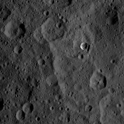 The 6-mile-wide (10-kilometer-wide) Oxo Crater stands out on the dark landscape of Ceres in this view from NASA's Dawn spacecraft.