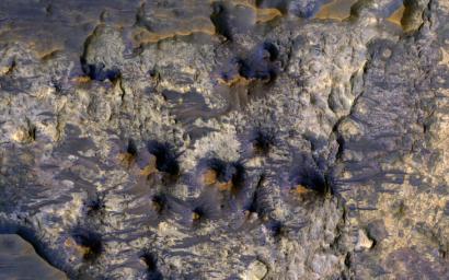 This image captured by NASA's Mars Reconnaissance Orbiter, shows the floor of Suzhi Crater, an approximately 25-kilometer diameter impact crater located northeast of Hellas Planitia.