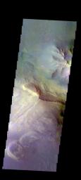 The THEMIS camera contains 5 filters. The data from different filters can be combined in multiple ways to create a false color image. This image from NASA's 2001 Mars Odyssey spacecraft shows part of the interior of Coprates Chasma.