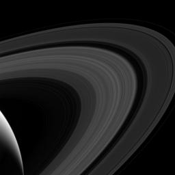 This view from NASA's Cassini spacecraft looks toward the sunlit side of the rings from above the ringplane. Although the rings lack the many colors of the rainbow, they arc across the sky of Saturn.