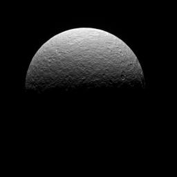This image is of NASA's Cassini spacecraft's final observation of Saturn's icy moon Rhea on May 2, 2017. The spacecraft was at the time high above the plane of Saturn's rings, looking down at Rhea's northern hemisphere.